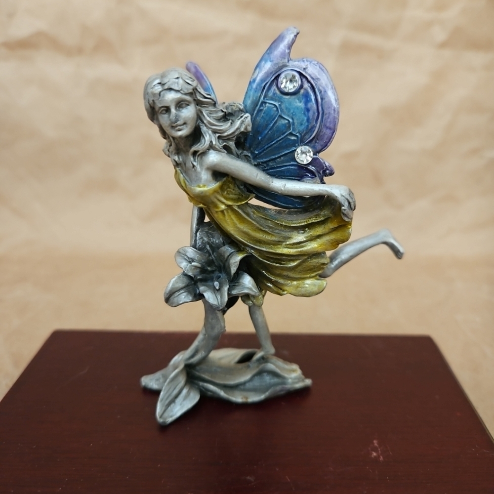 Metal Fairy Standing On Flower With Jeweled Wings